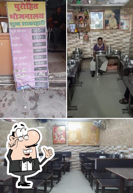 Among different things one can find interior and food at Purohit Bhojnalya