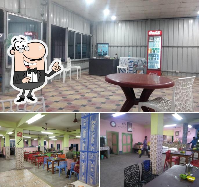 Take a seat at one of the tables at বাগের হোটেল