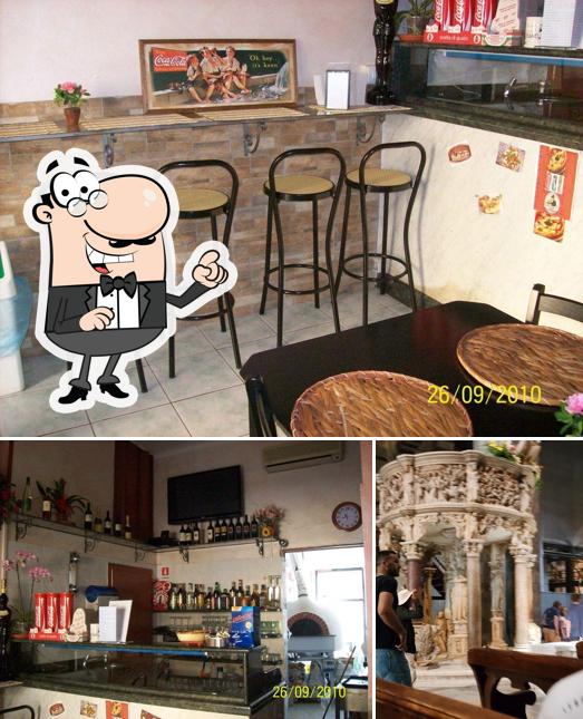 Dai un'occhiata agli interni di Al solito posto