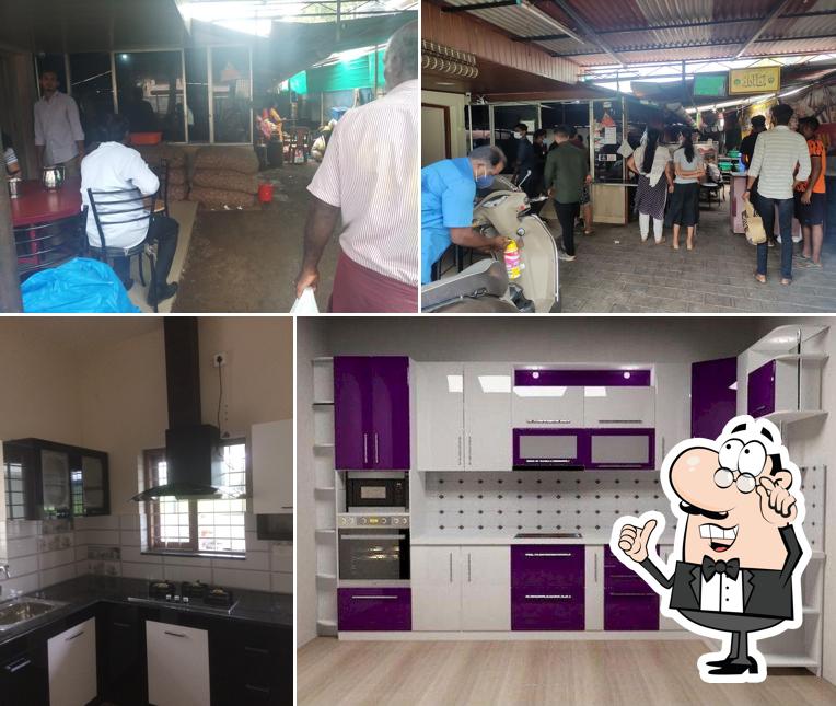 Take a seat at one of the tables at C B Catering and Restaurant