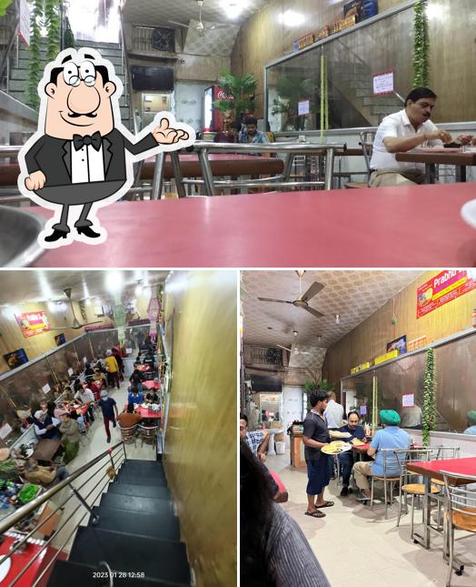 Take a seat at one of the tables at Prabhu Ji Paharganj Wale Chhole Bhature
