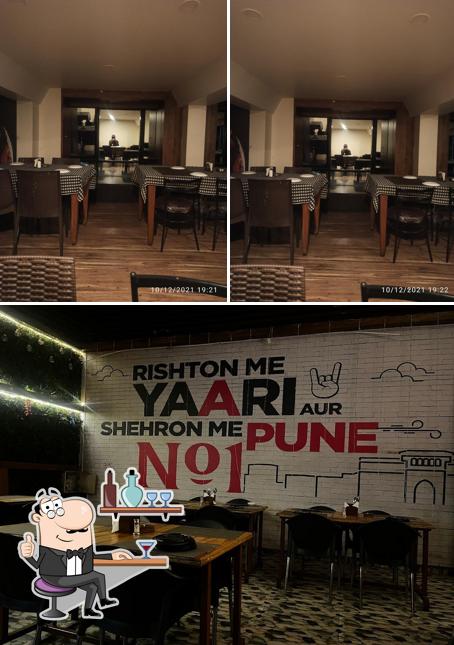 Take a seat at one of the tables at Hotel Farmaish