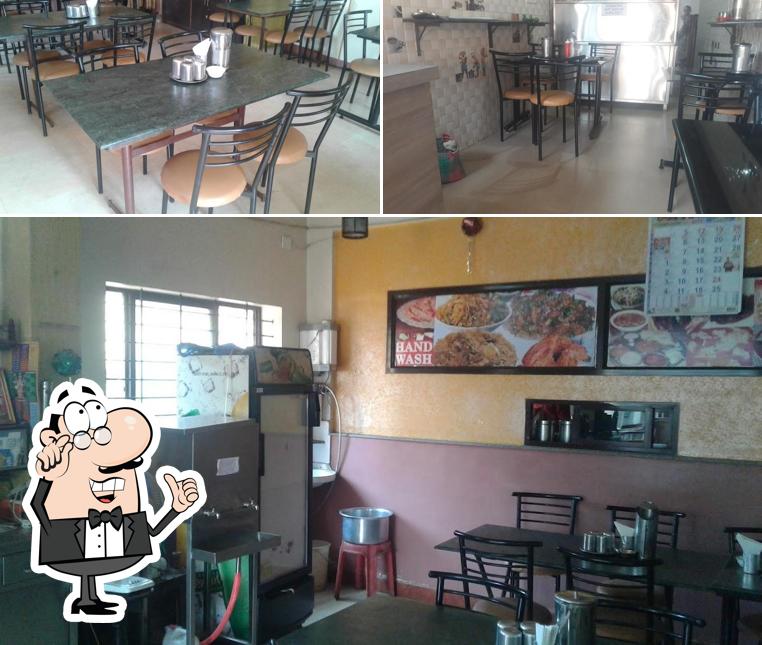 Take a seat at one of the tables at Hotel Abhiruchi