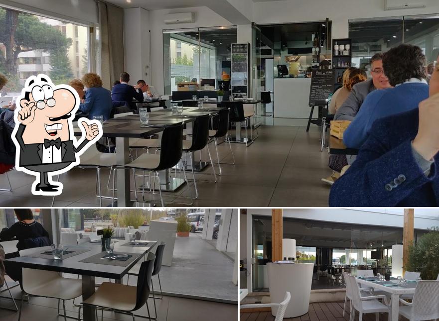 Questa è la foto che mostra la interni e tavolo da pranzo di In & Out