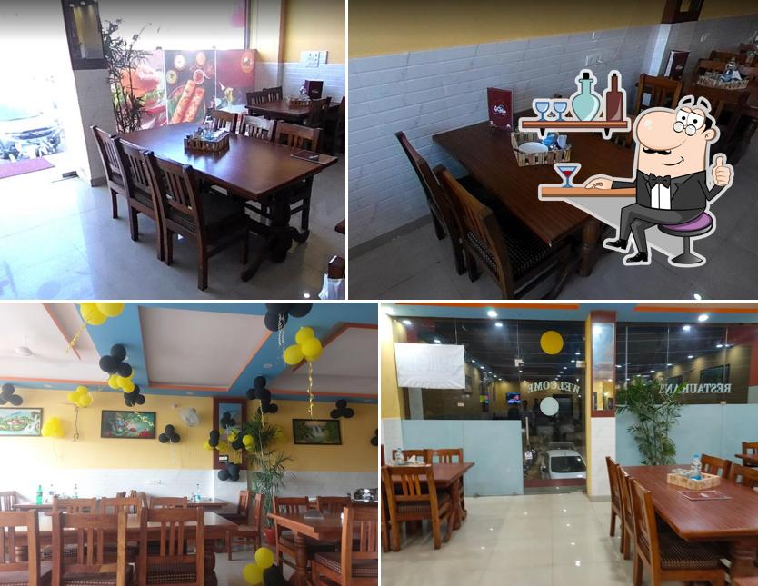 Take a seat at one of the tables at 4 Chef - AIIMS, Rishikesh