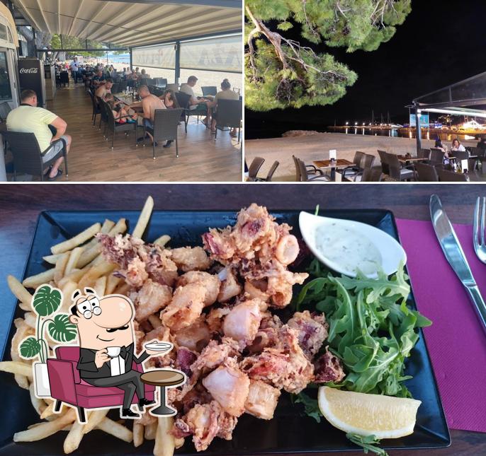 La foto di interni e cibo da Restoran Plaža