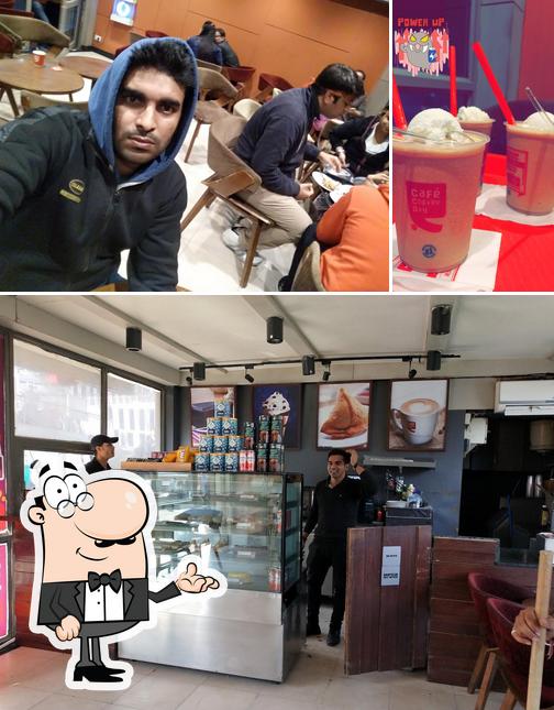 Among different things one can find interior and drink at Cafe Coffee Day - Ardh Kuwari