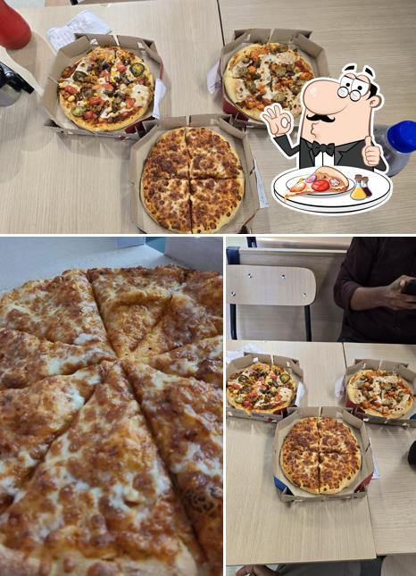Pick pizza at Domino's Pizza Karaparamba, Kozhikode