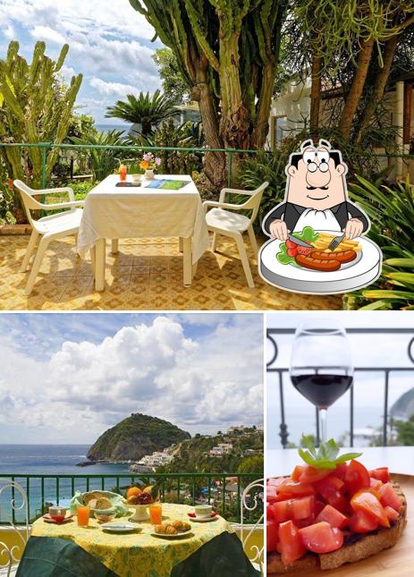 Questa è la foto che presenta la cibo e tavolo da pranzo di Hotel Villa Franz