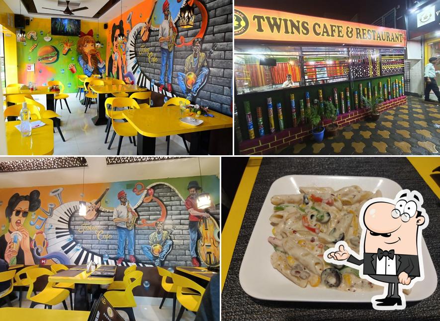 Take a seat at one of the tables at TWINS CAFE & RESTAURANT