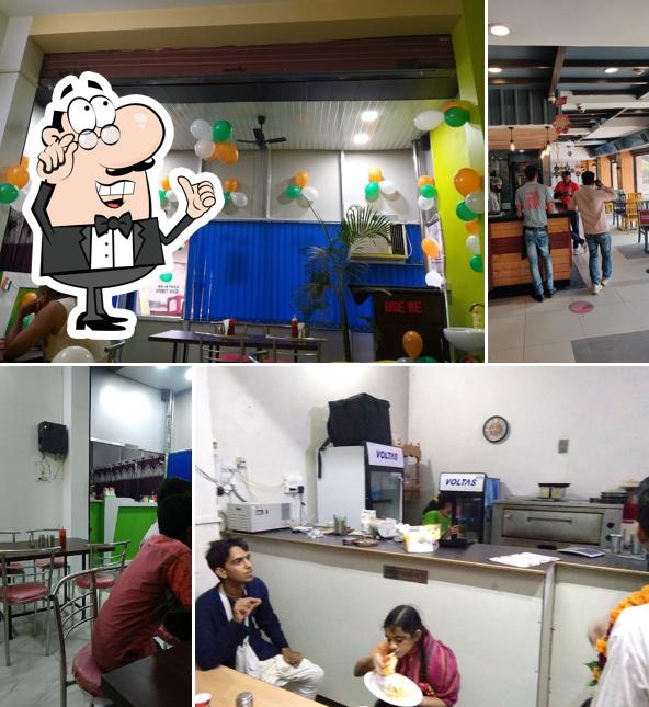 Take a seat at one of the tables at Pizza Olive