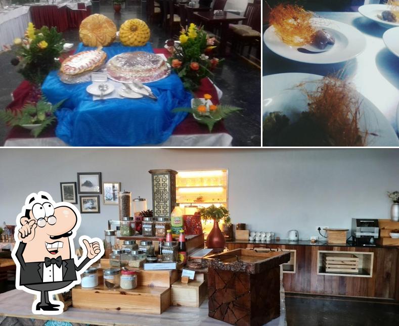 The image of interior and dining table at Blue Pine Restaurant