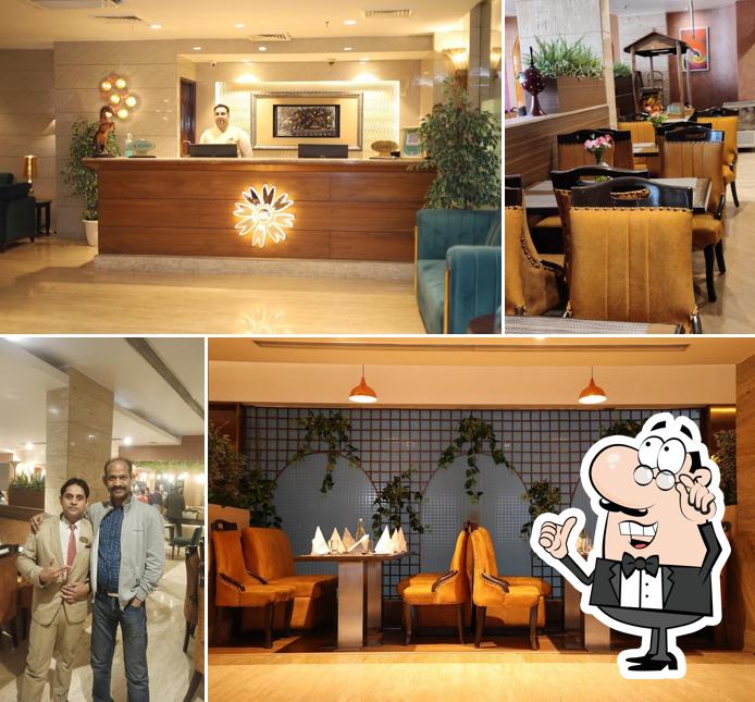 Take a seat at one of the tables at Bayleaf Multi Cuisine Restaurant