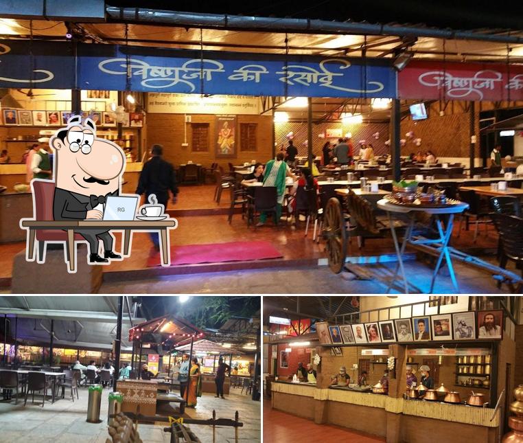 Take a seat at one of the tables at Vishnuji Ki Rasoi