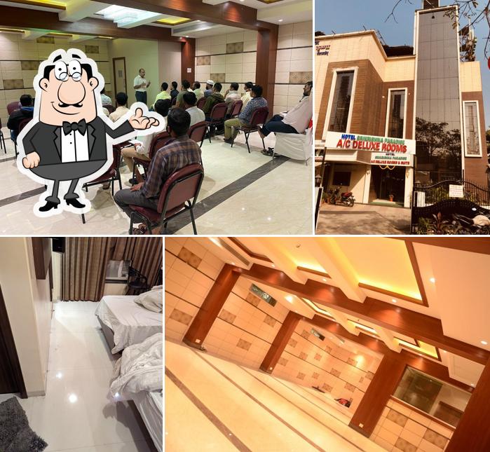 Take a seat at one of the tables at Srikrishna Paradise Hotel