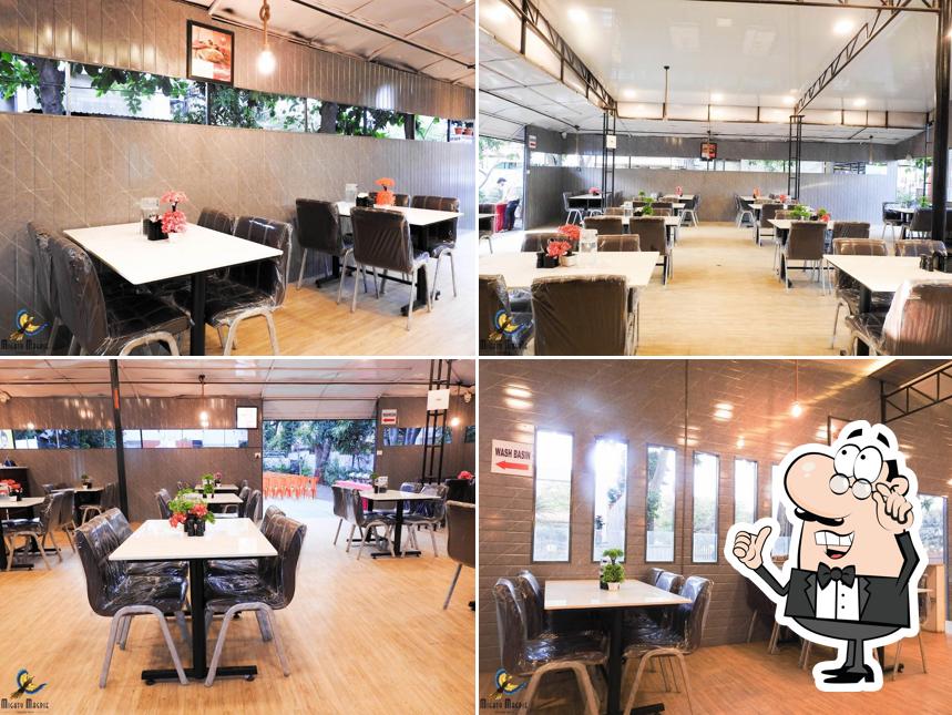 Take a seat at one of the tables at Radhika Dine Inn