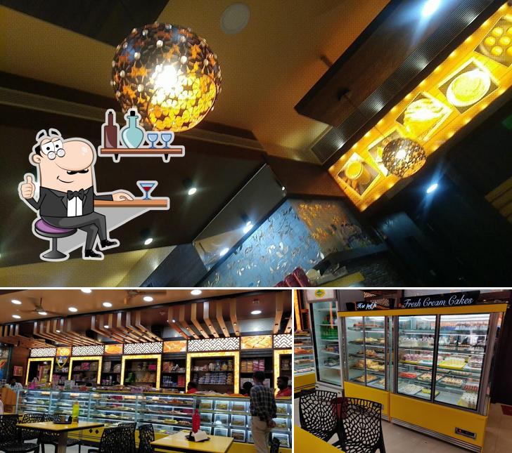 Take a seat at one of the tables at A1 Divya Sweets And Bakery A1 திவ்யா இனிப்பகம்