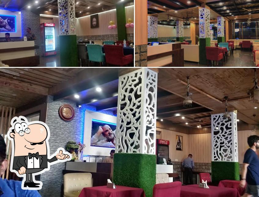 Take a seat at one of the tables at Janki Restaurant