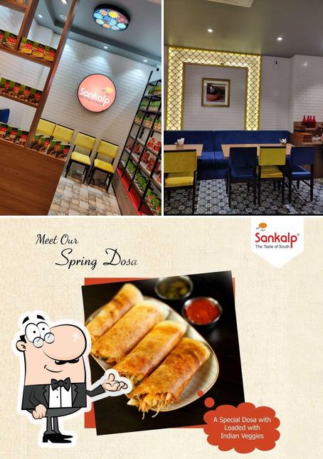This is the image displaying interior and food at Sankalp Restaurant