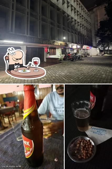 The photo of Aiswarya wine and beer’s food and exterior