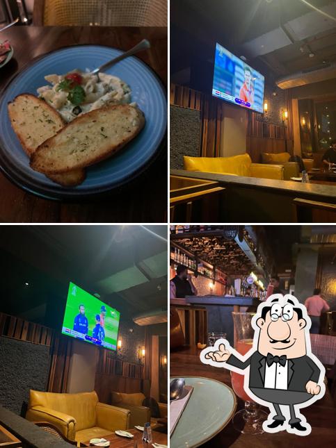 Take a seat at one of the tables at Hops n Grains Kitchen & Brewery