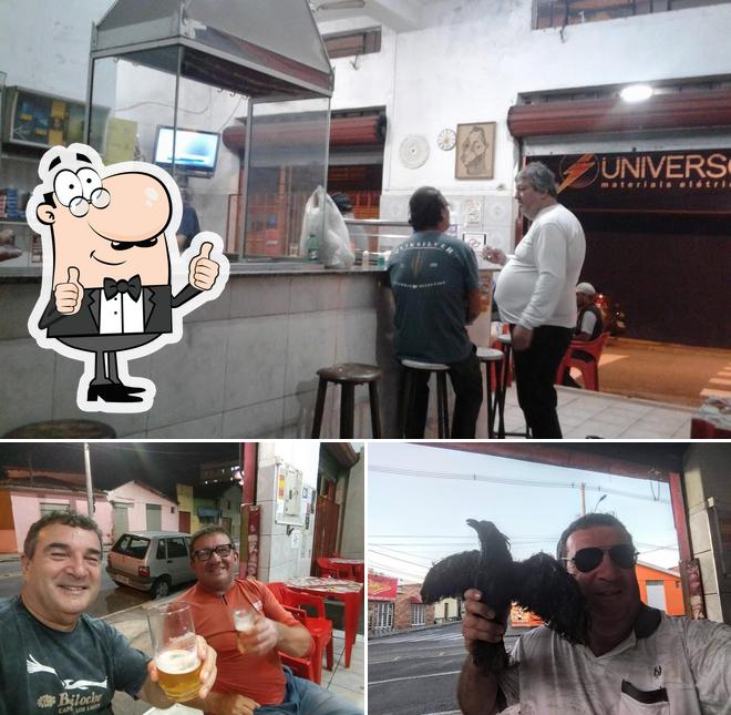 Look at the photo of Bar Do Corvo