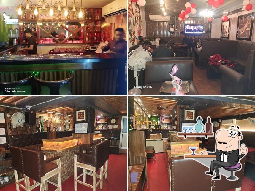 Take a seat at one of the tables at DAY NIGHT BAR AND RESTAURANT