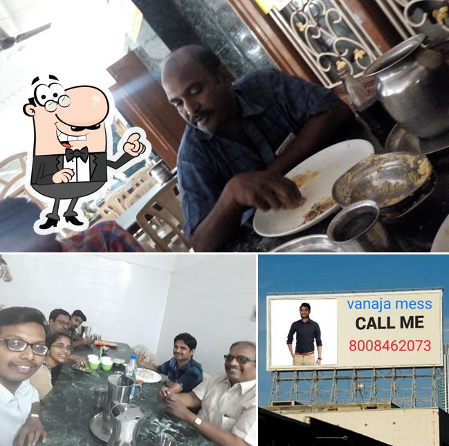 Take a seat at one of the tables at Vanaja Student Mess and Function Hall