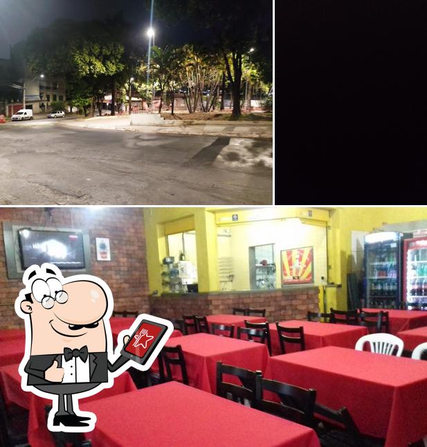 A imagem do MEGA TOM PIZZARIA’s exterior e interior