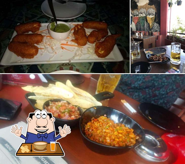 Among different things one can find food and dining table at Pecos Hideout Koramangala