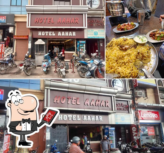 This is the photo showing exterior and beverage at Hotel Aahar