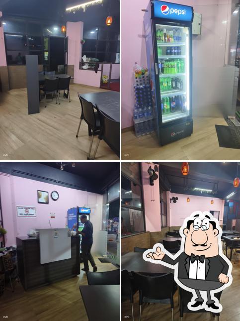 Take a seat at one of the tables at Al Raidan Mandhi House Kakkodi