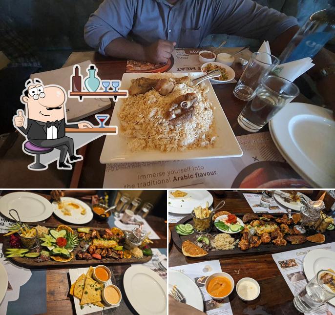 Take a seat at one of the tables at QAHWA