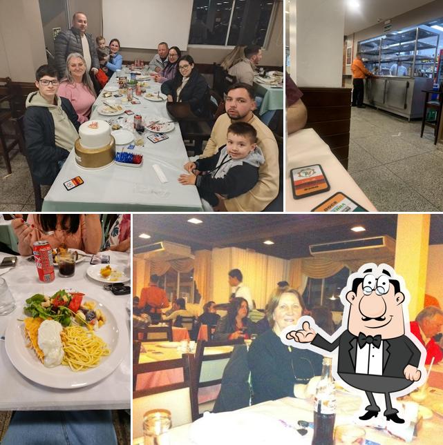 Sente em uma das mesas no Bella Trento Restaurante e Pizzaria