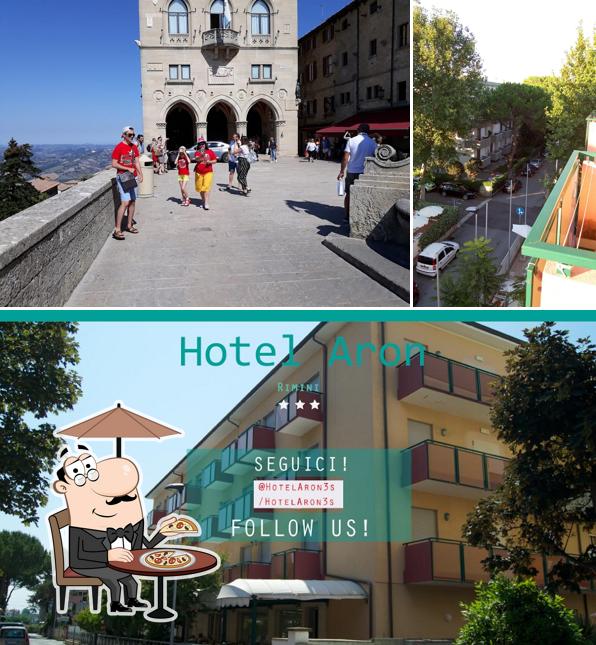 Puoi goderti l'aria fresca da seduto all'esterno di Hotel Aron