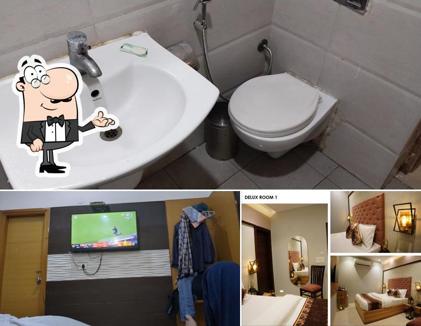 Take a seat at one of the tables at Divud Ecom Hotel