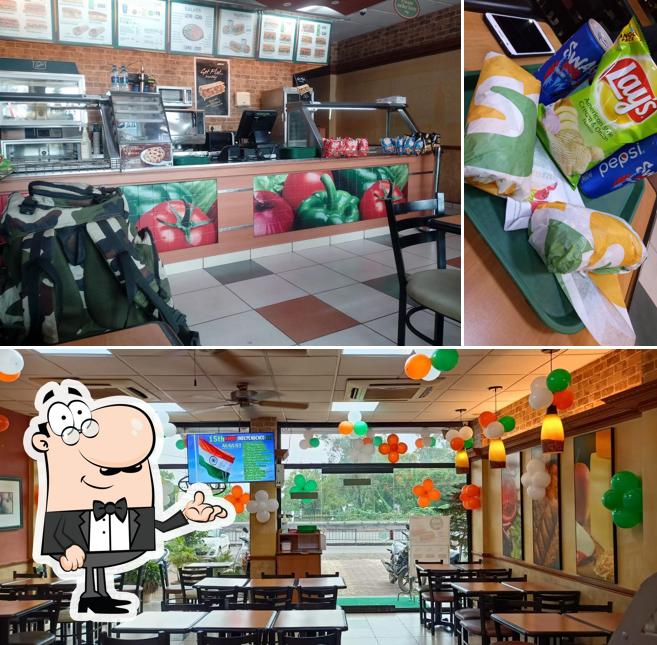 Take a seat at one of the tables at Subway Gokul Vihar