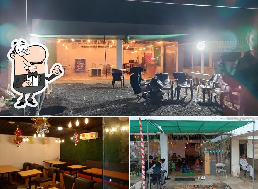 Take a seat at one of the tables at I SONAL KRUPA RESTAURENT