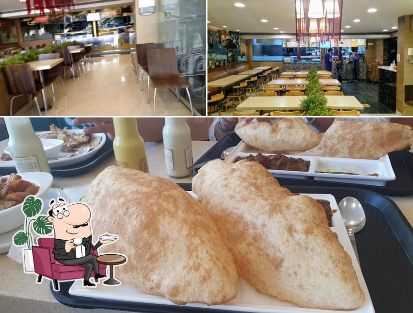 This is the picture depicting interior and food at Anand Sweets - Kormangala