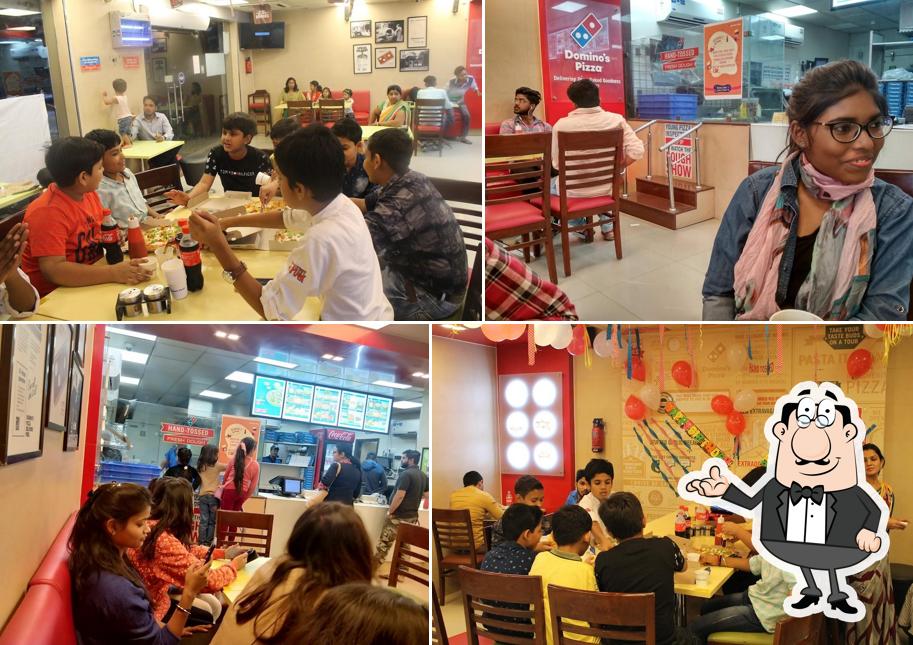 Take a seat at one of the tables at Domino's Pizza Bundelkhand University, Jhansi