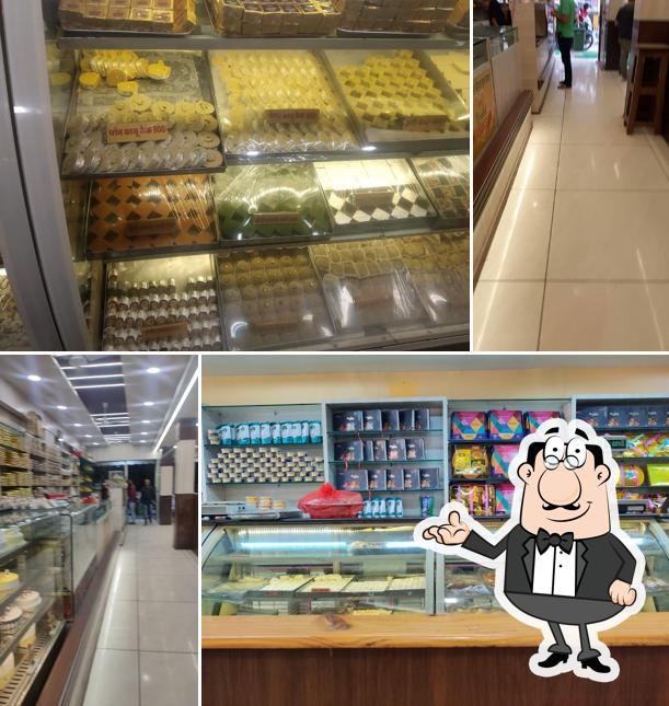 Take a seat at one of the tables at Apna Sweets