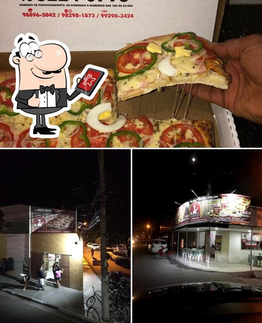 A exterior e pizza do restaurante