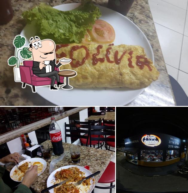 A imagem da interior e comida no Point do Baixinho