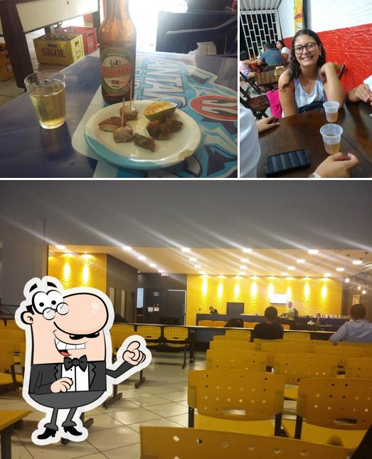 Confira a foto ilustrando interior e cerveja a Bahia Lanches- Lanchonete em Franca