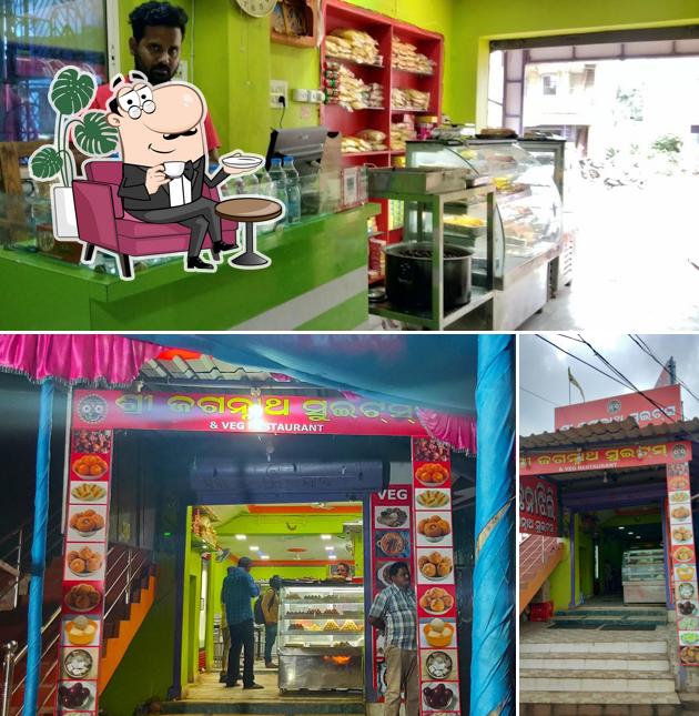 Take a seat at one of the tables at Shree Jagannath Sweets & Restaurant