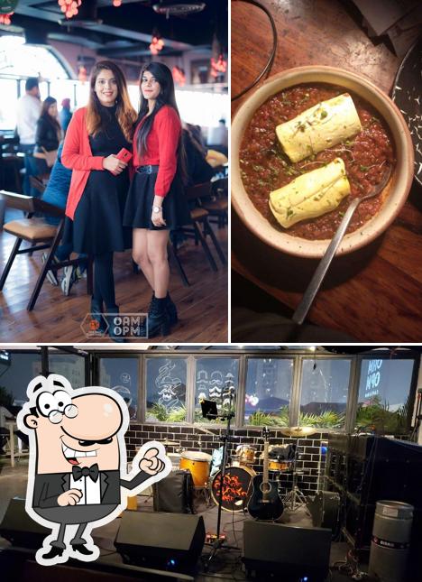 Take a seat at one of the tables at AMPM Cafe & Bar