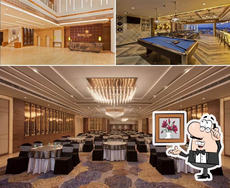 Take a seat at one of the tables at Lemon Tree Hotel Amritsar