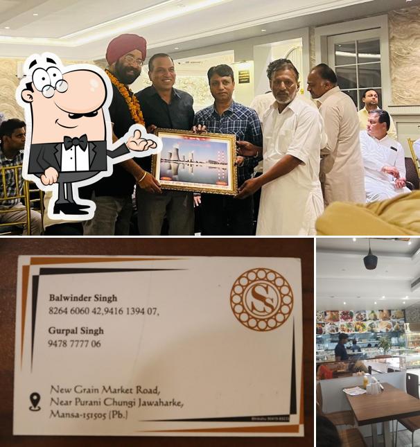 Take a seat at one of the tables at H o t e l R o m a n z a