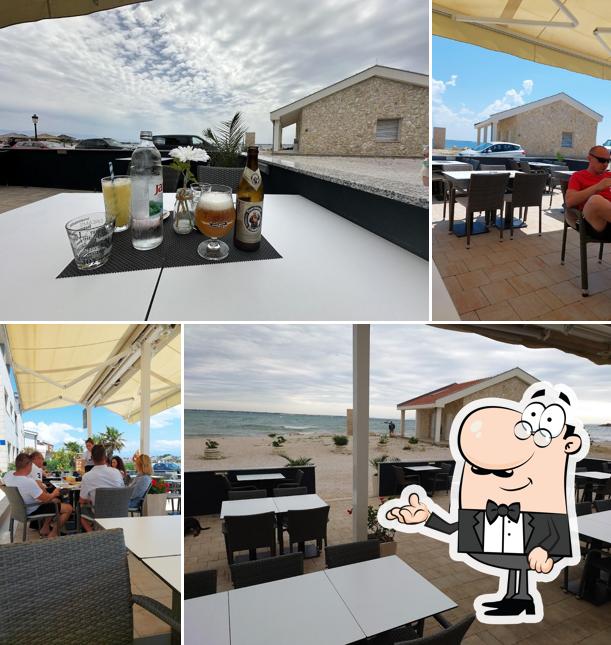 Dai un'occhiata agli interni di The Beach Fine Food & Bar
