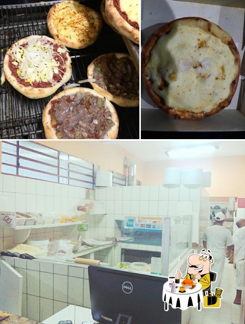 Entre diferentes coisas, comida e interior podem ser encontrados no Pizzaria Brasil